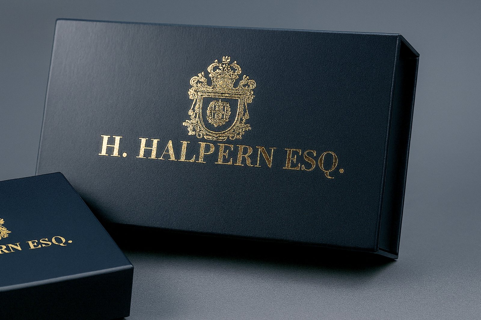 Gold foil crest on a black magnetic gift box